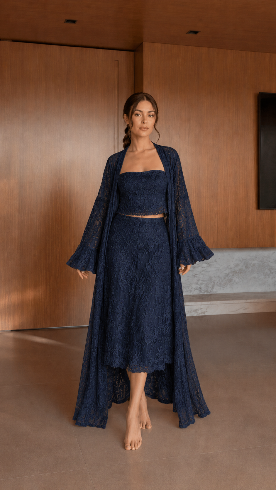 Front view of navy textured 3-piece skirt set with bell-sleeve long duster