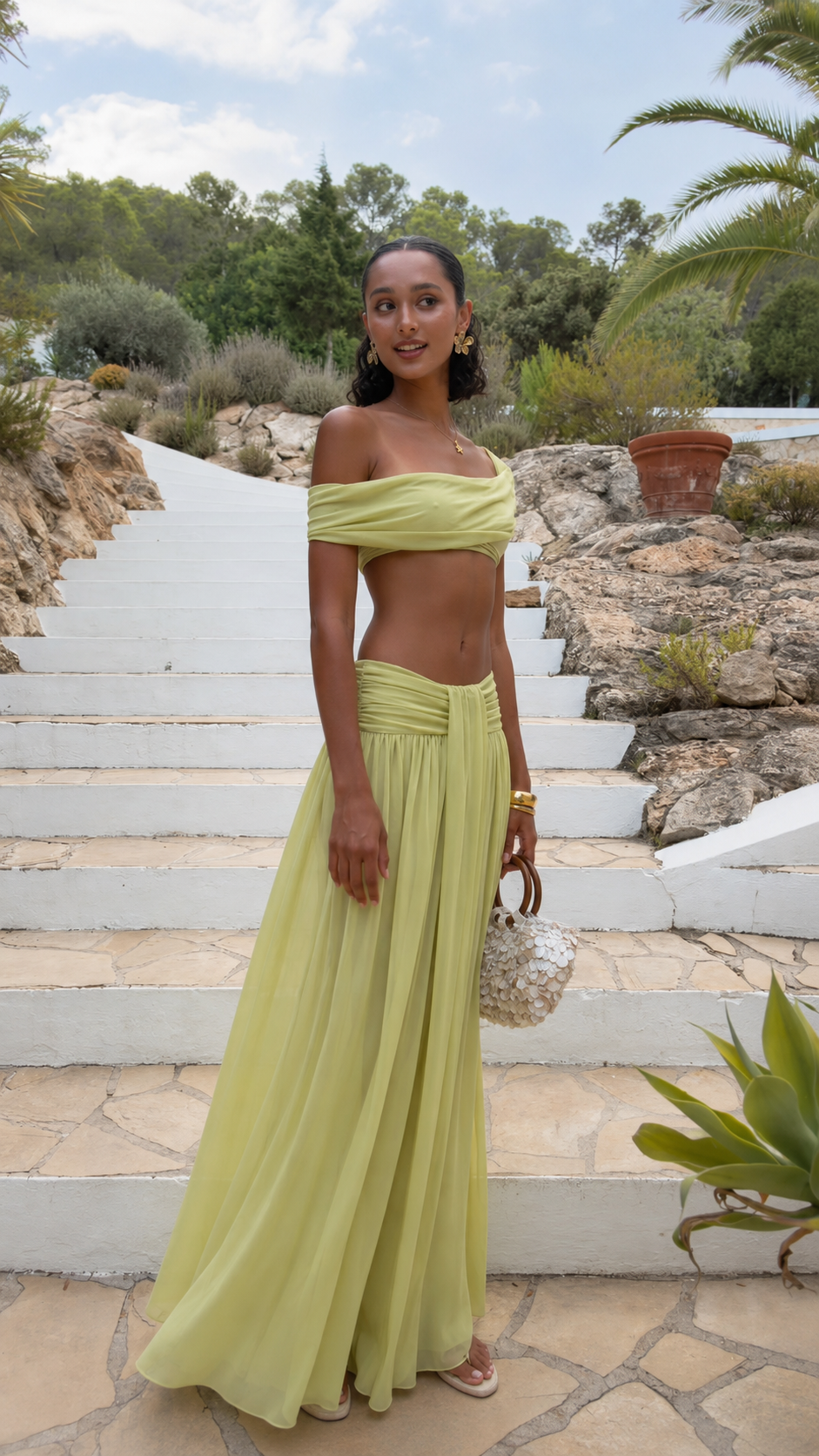 Pistachio off-shoulder two piece maxi skirt set shown from the front with gathered waist detail