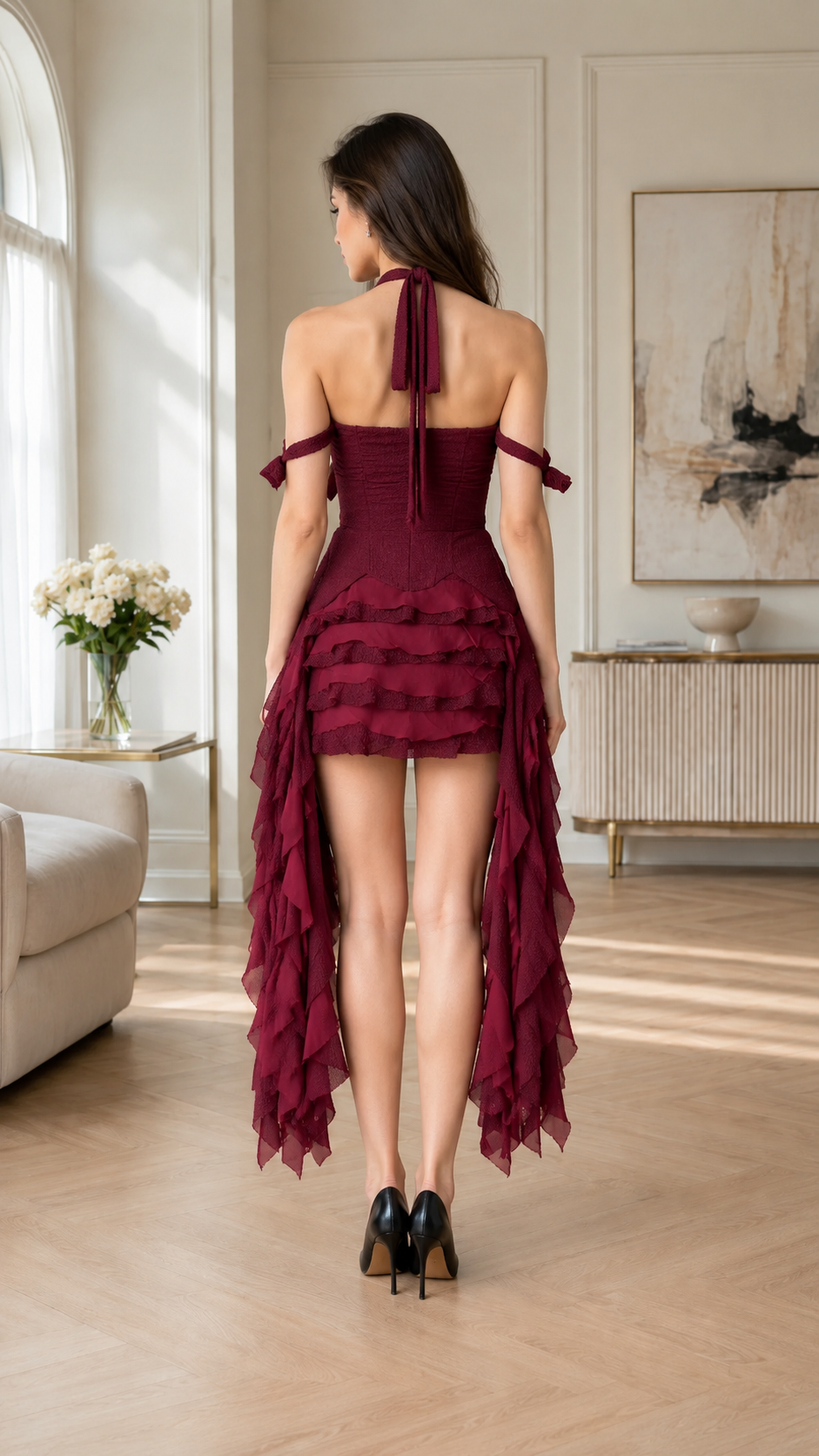 Back view of burgundy cross halter dress with cascading high-low hem