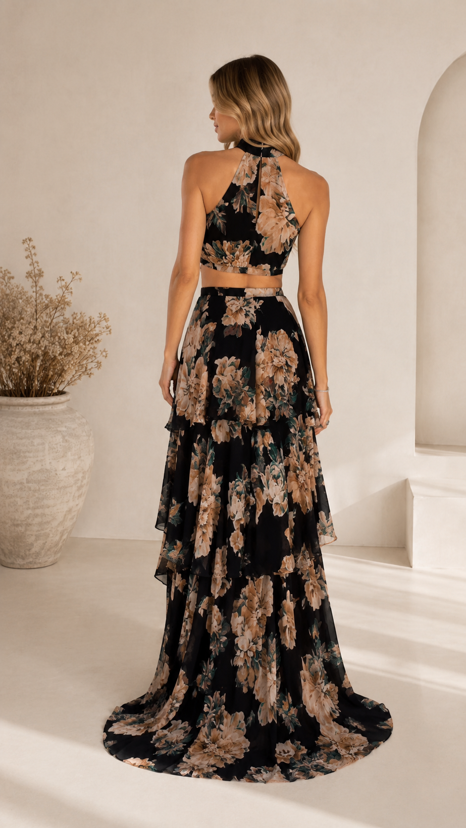 Back view of black floral halter two-piece maxi dress set with open-back look