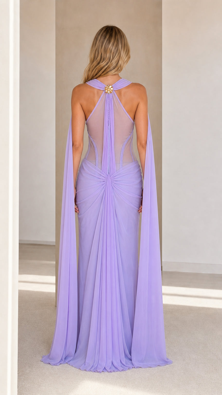 Model wearing lavender cape maxi dress back view showing sheer mesh and capes