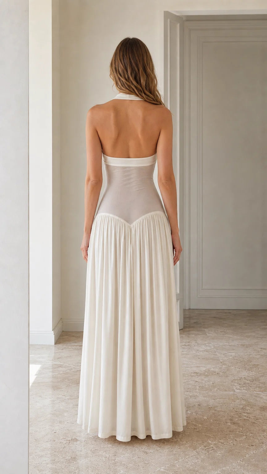 Back view of White halter neck maxi dress showing open back design