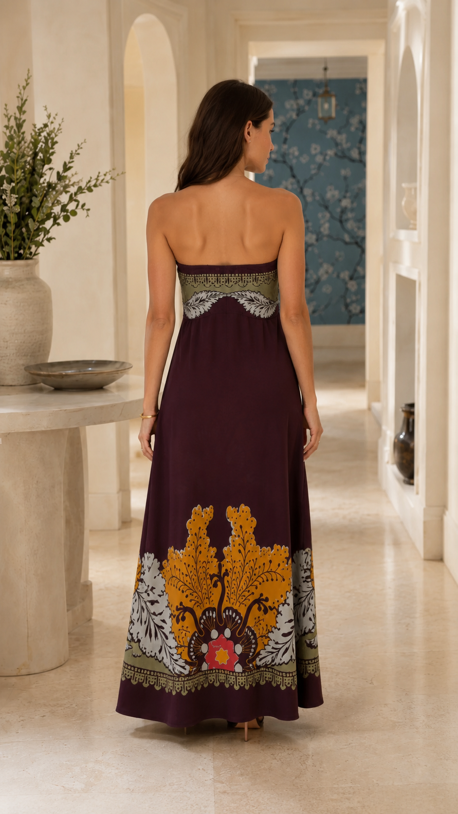 Back view of wine strapless maxi dress with printed upper band