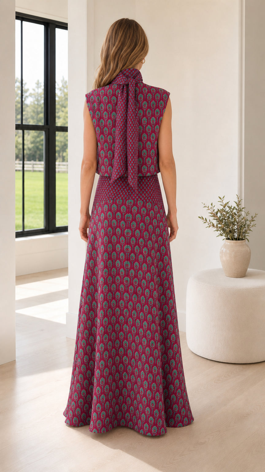 Back view of model in berry two-piece set showing tie detail