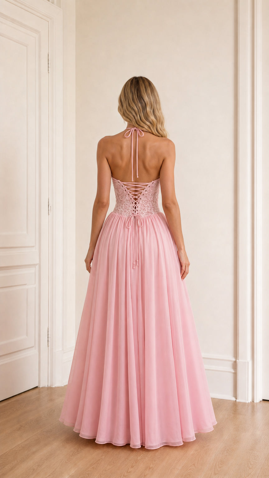 Model wearing pink evening dress back view showing lace-up detail