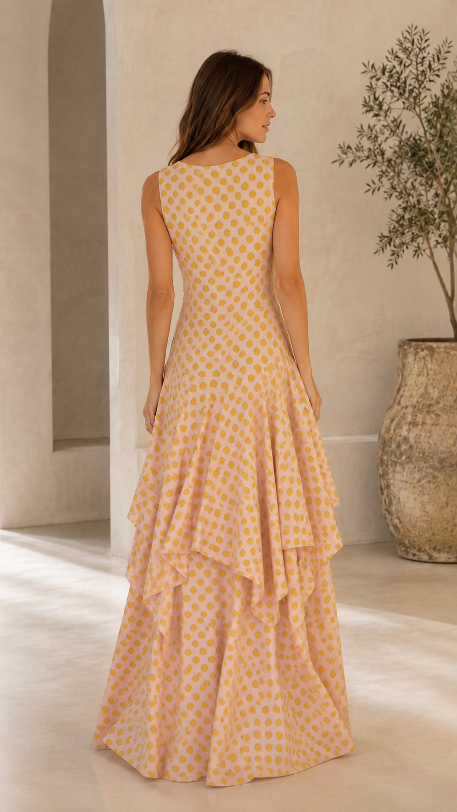 Back view of blush yellow embroidered polka dot tiered maxi dress