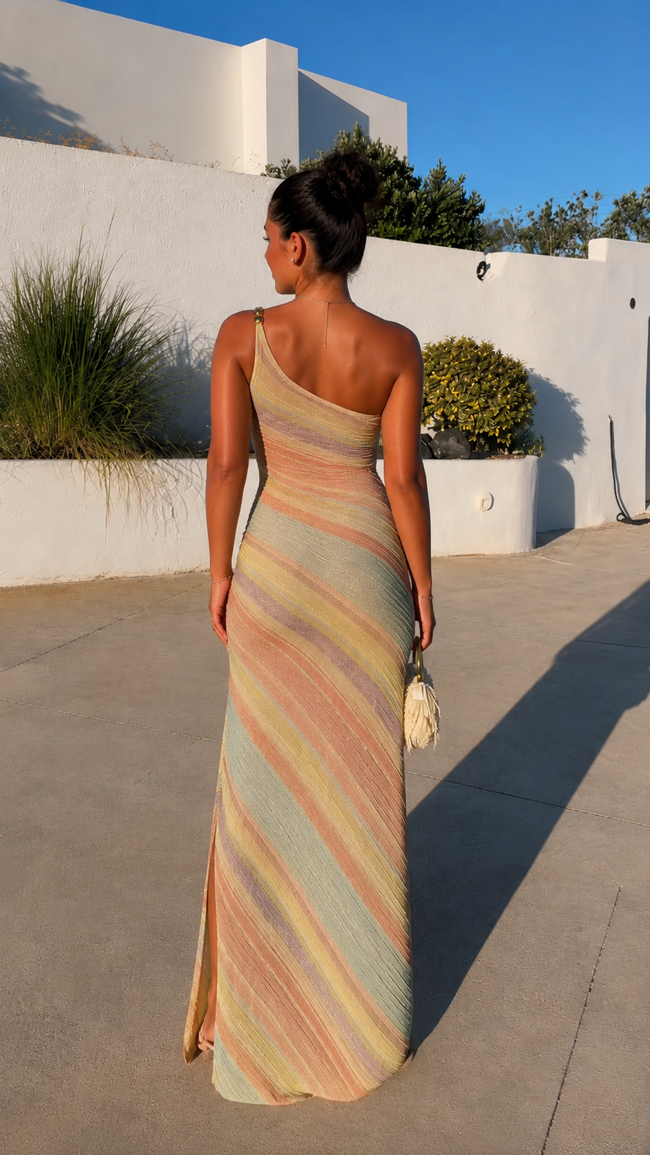 Back view of pastel striped asymmetrical maxi dress