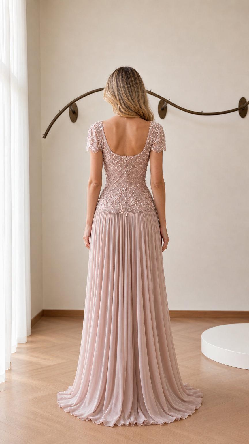 Back view showing scoop back and pleated train of blush pink gown