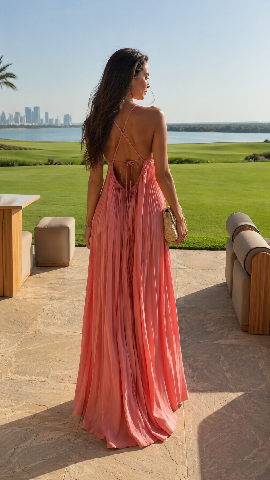 Back view of blush pink open back pleated maxi dress