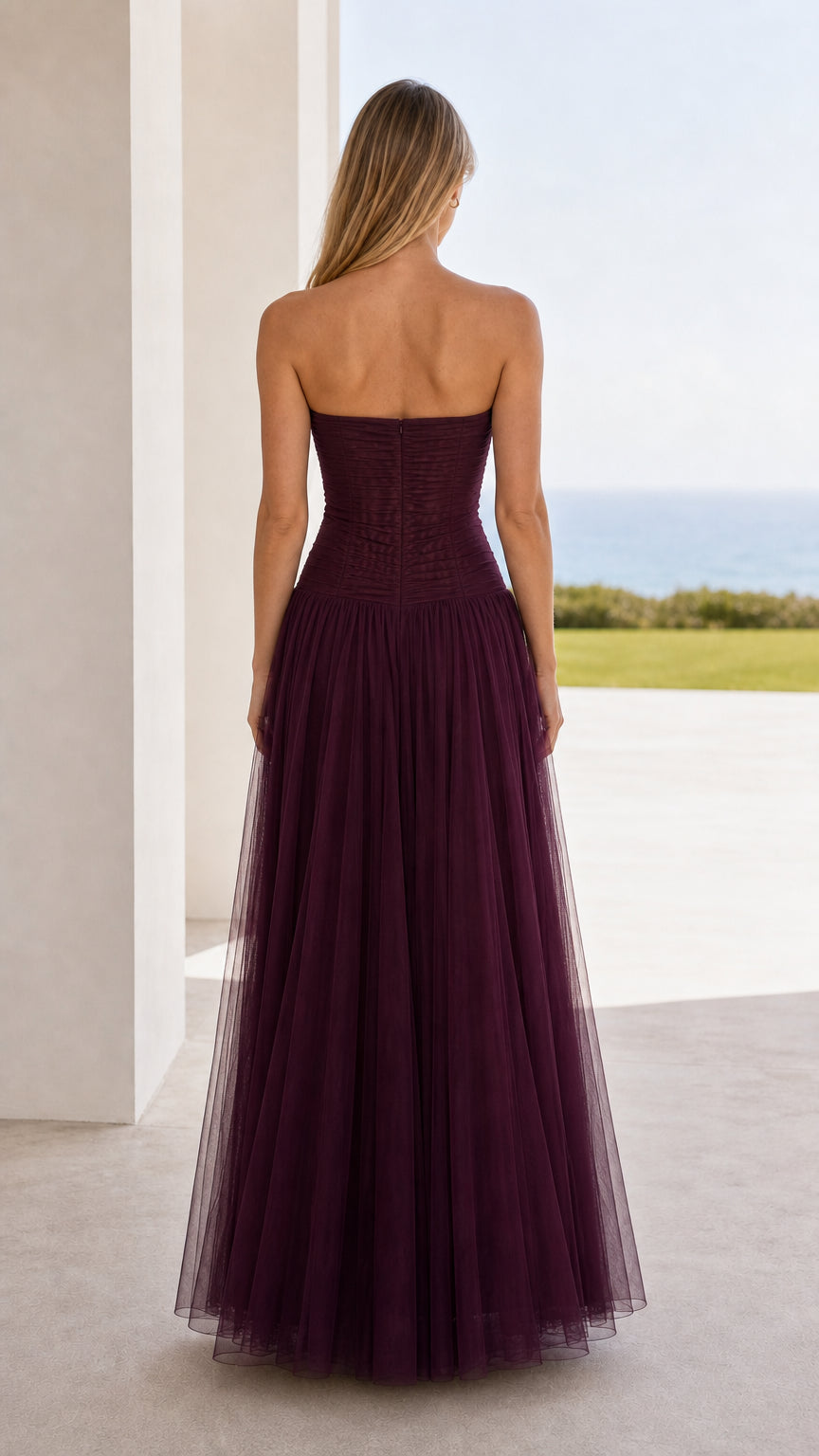 Back view of burgundy strapless ruched tulle maxi dress