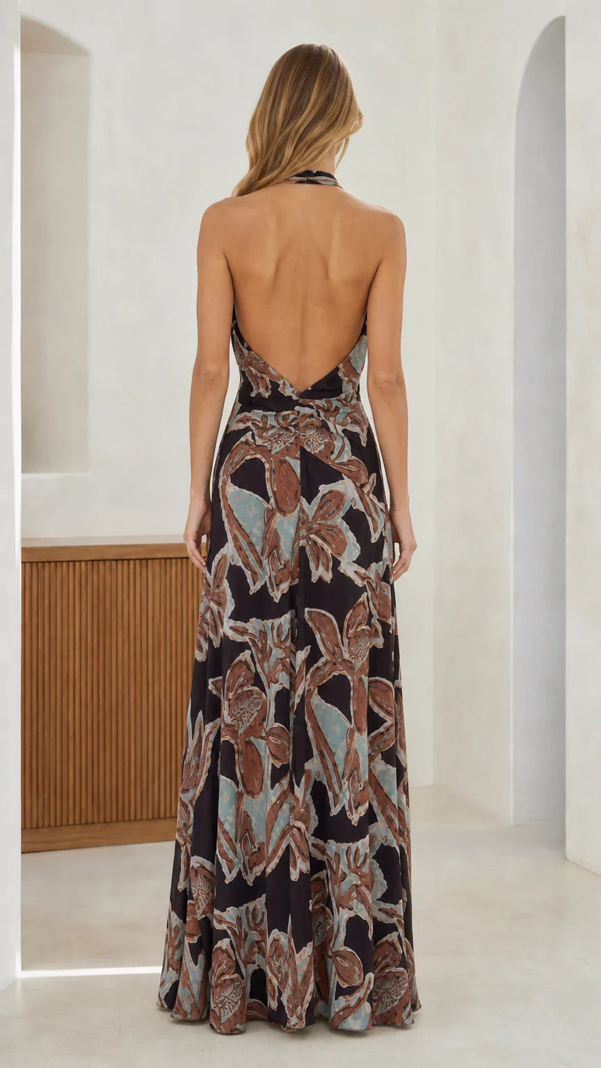 Back view showcasing open back design of the black maxi dress