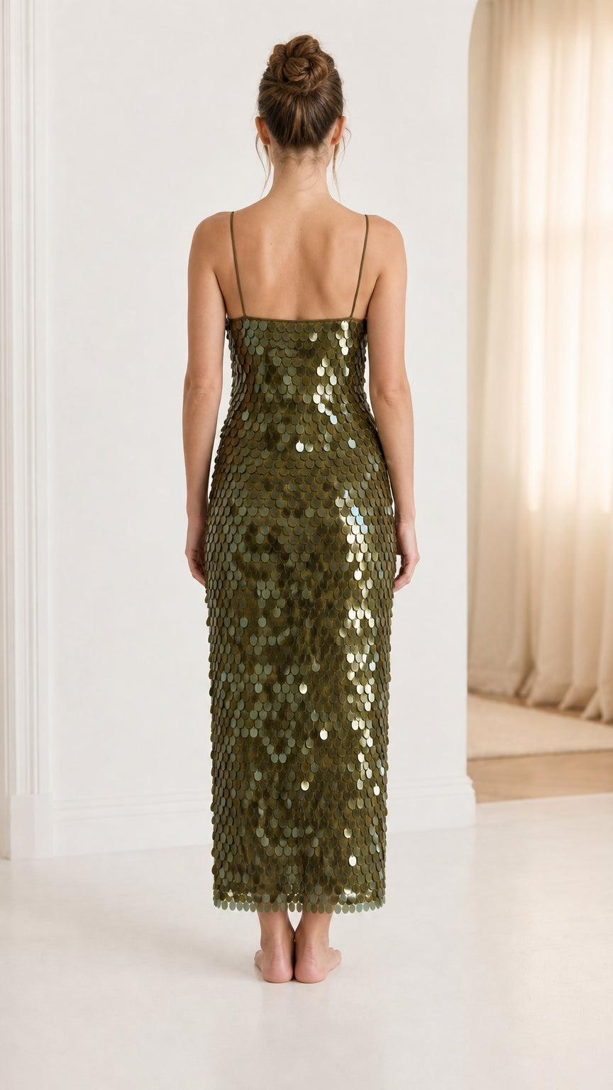 Back view of woman in olive green sequin midi dress