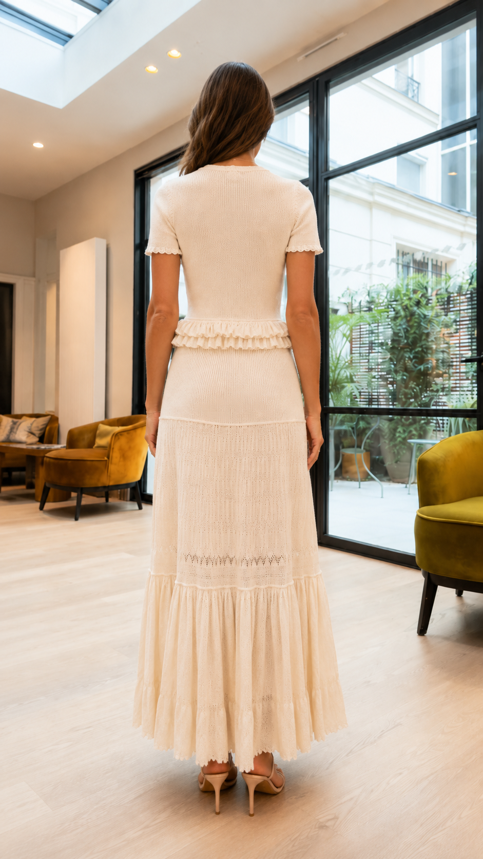 Back view of cream short-sleeve knit top and tiered maxi skirt matching set
