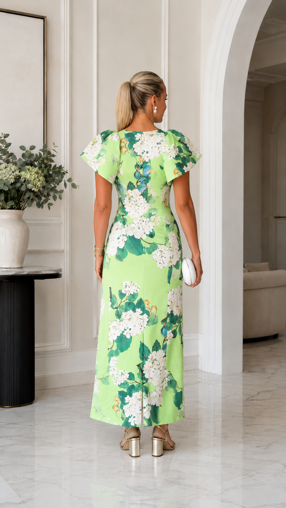 Back view of lime green floral flutter sleeve maxi dress