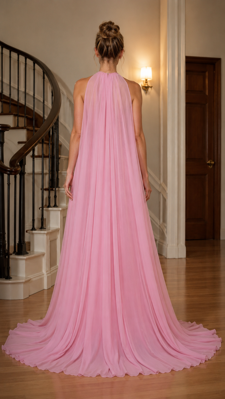 Pink floor-length halter gown back view with full flowing train effect