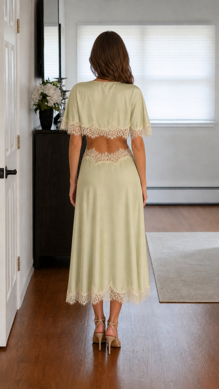 Back view of sage satin midi dress with back cutout detail