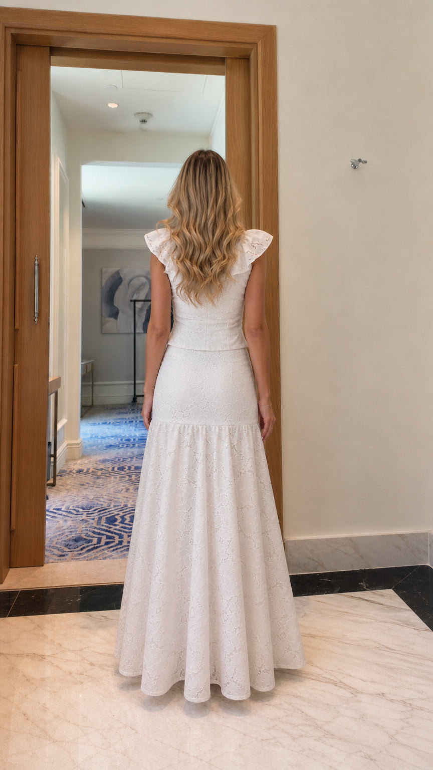 Model wearing white lace two-piece set, back view