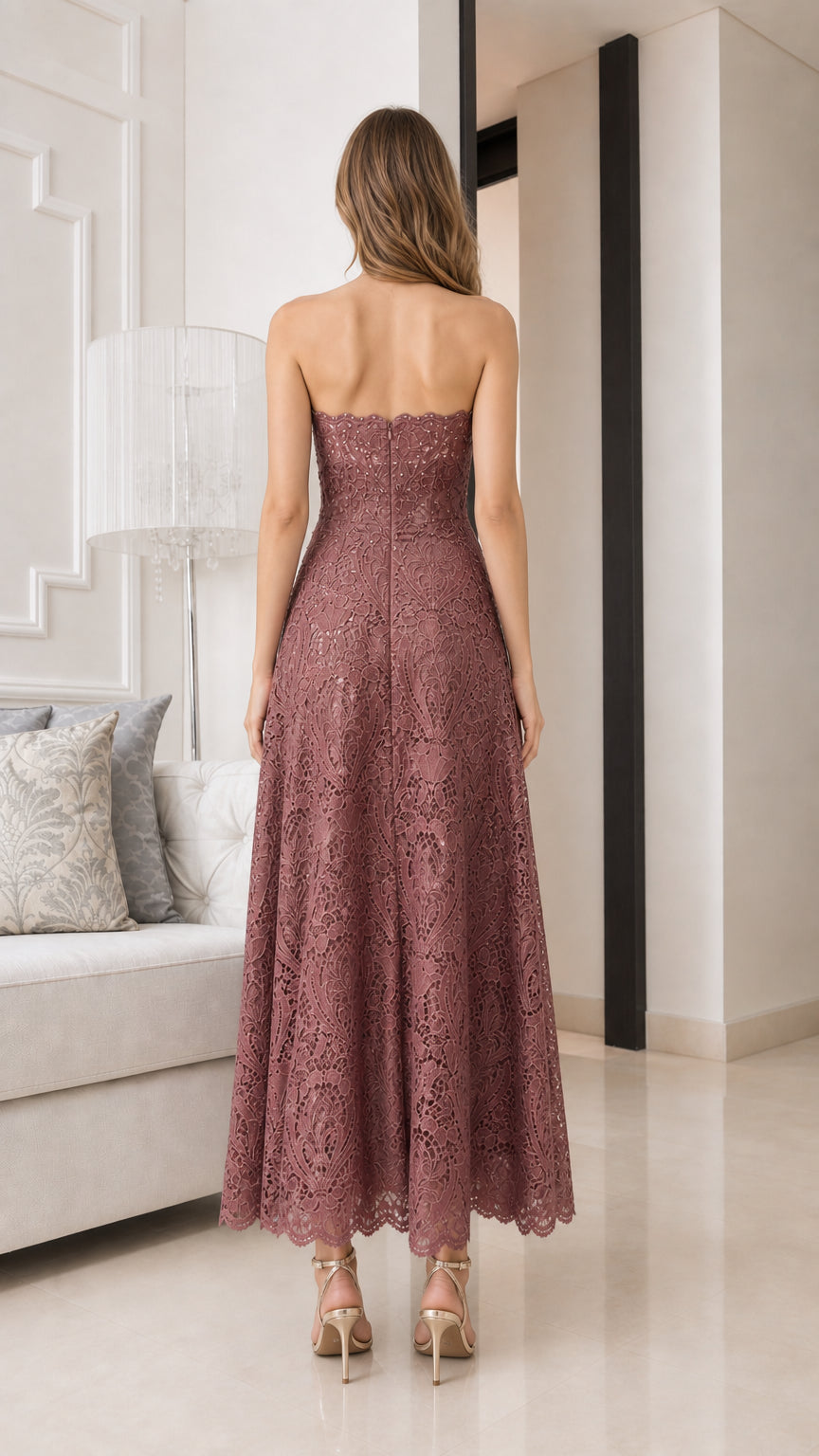 Back view of model wearing mauve strapless lace midi dress