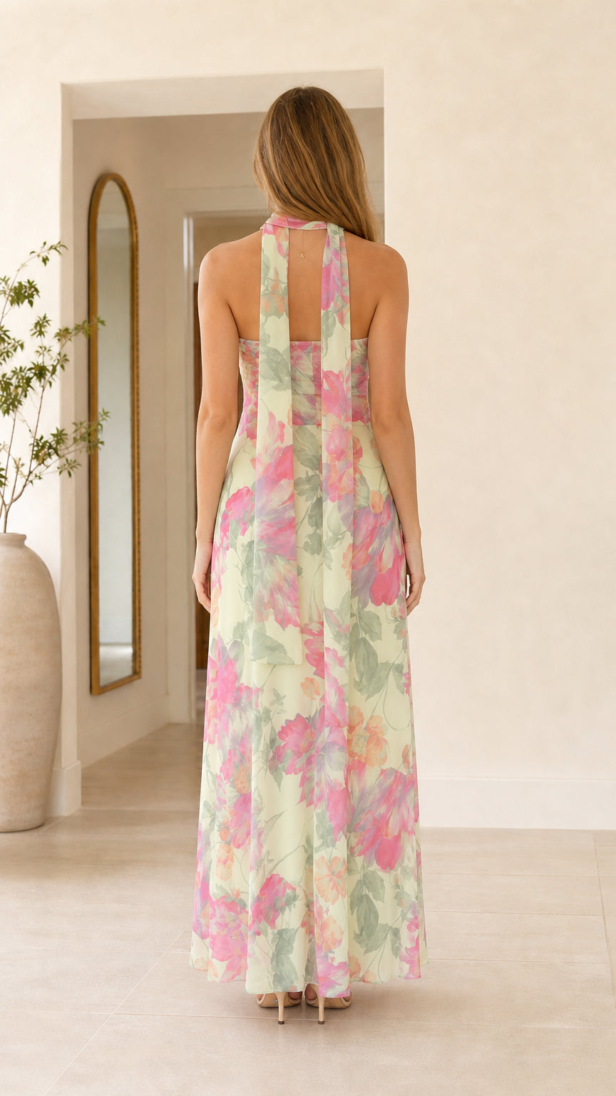 Back view of mint green floral maxi dress showing scarf detail
