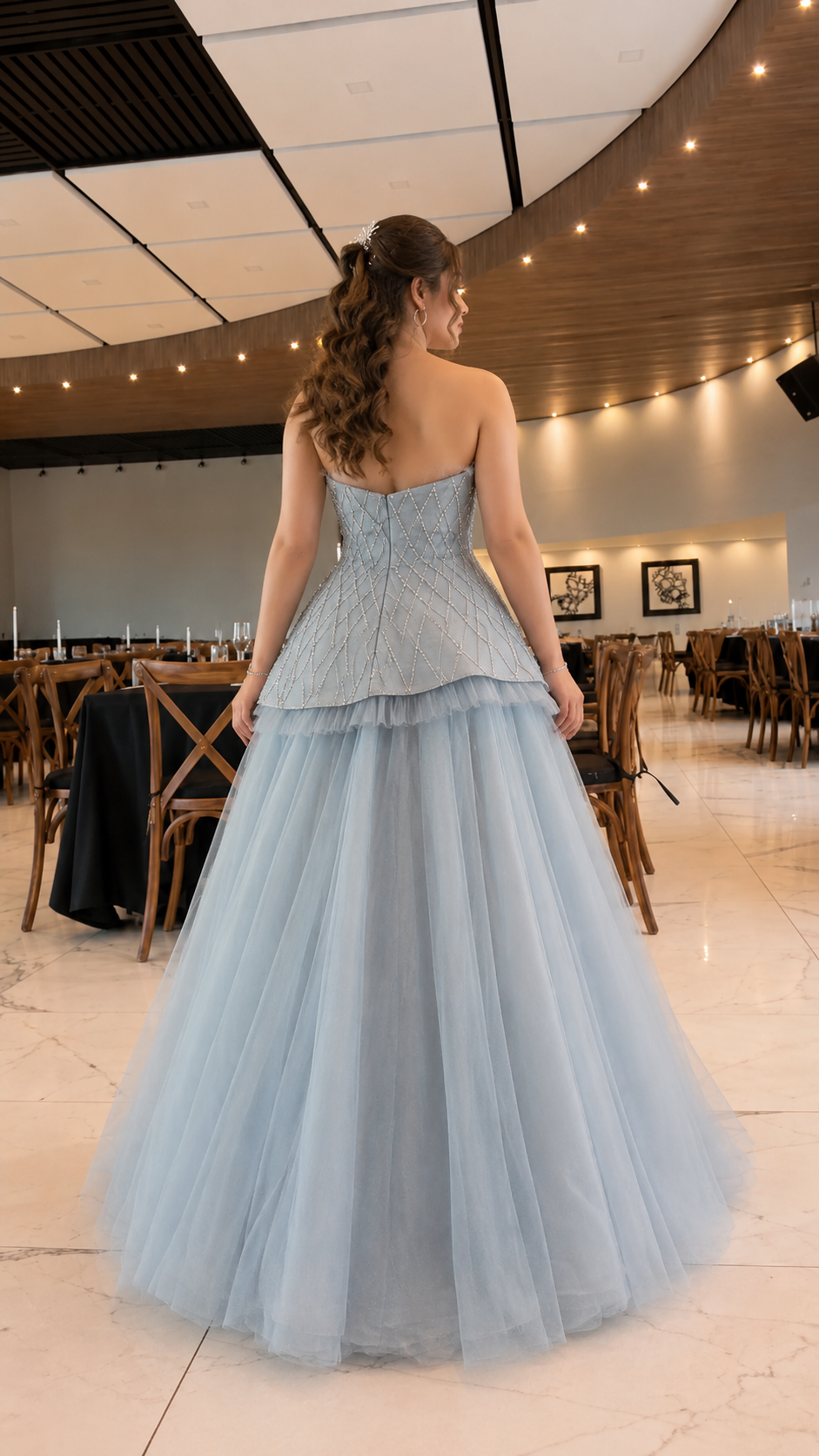 Back view of dusty blue formal tulle gown with full-length skirt