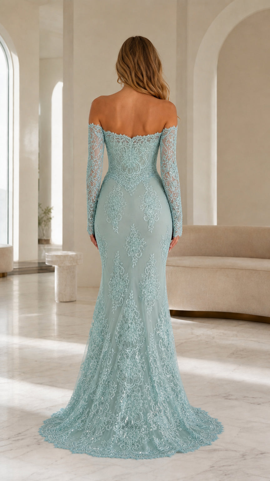 Back view of model showing sweep train on sage lace gown