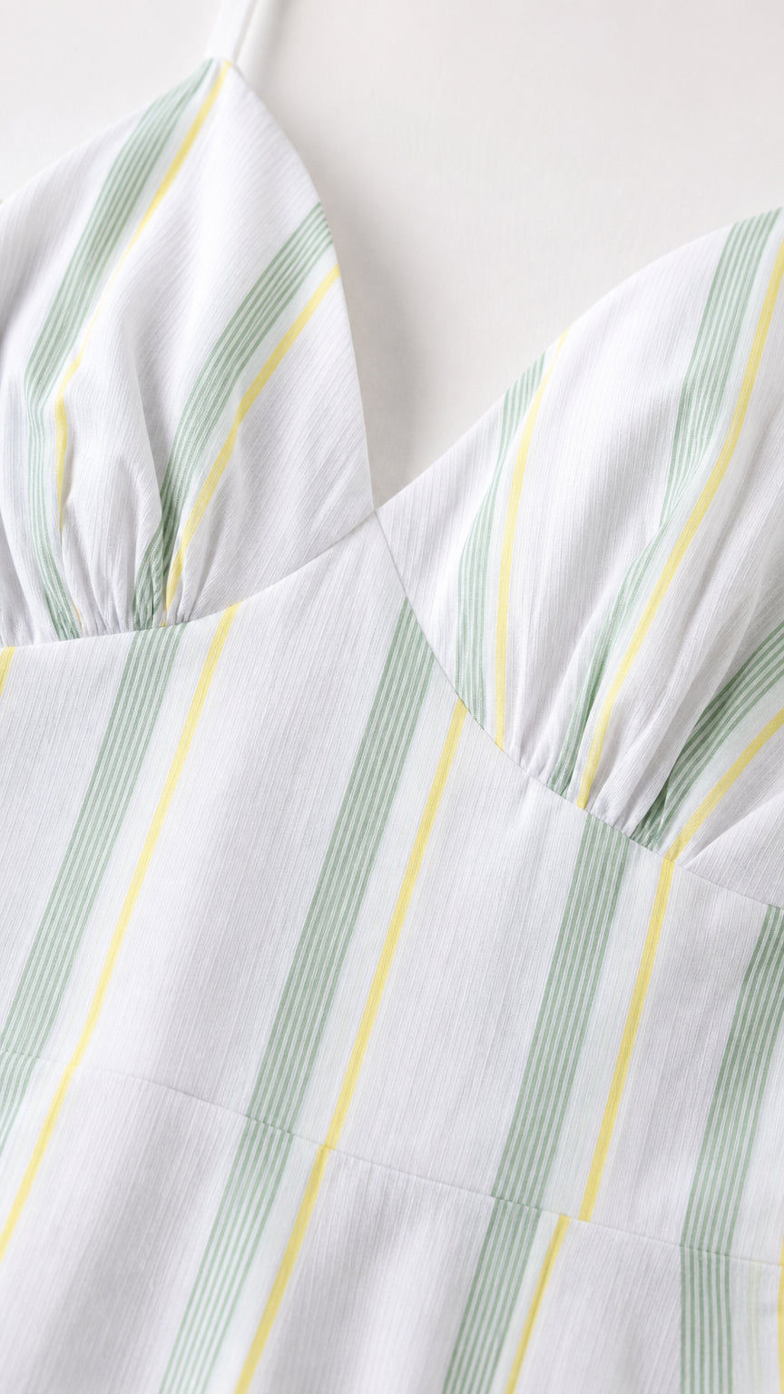 Close-up detail of the gathered bodice and vertical stripe pattern
