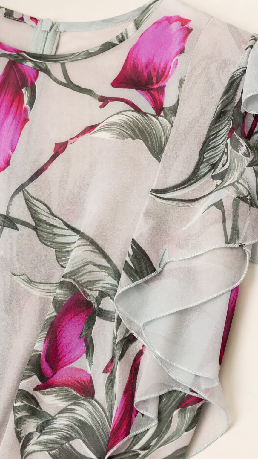 Close-up fabric and ruffle detail of the floral print chiffon dress
