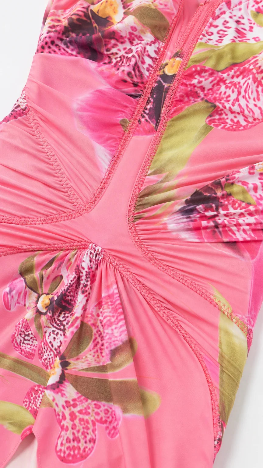 Close-up detail of front ruching and fabric pattern on pink dress