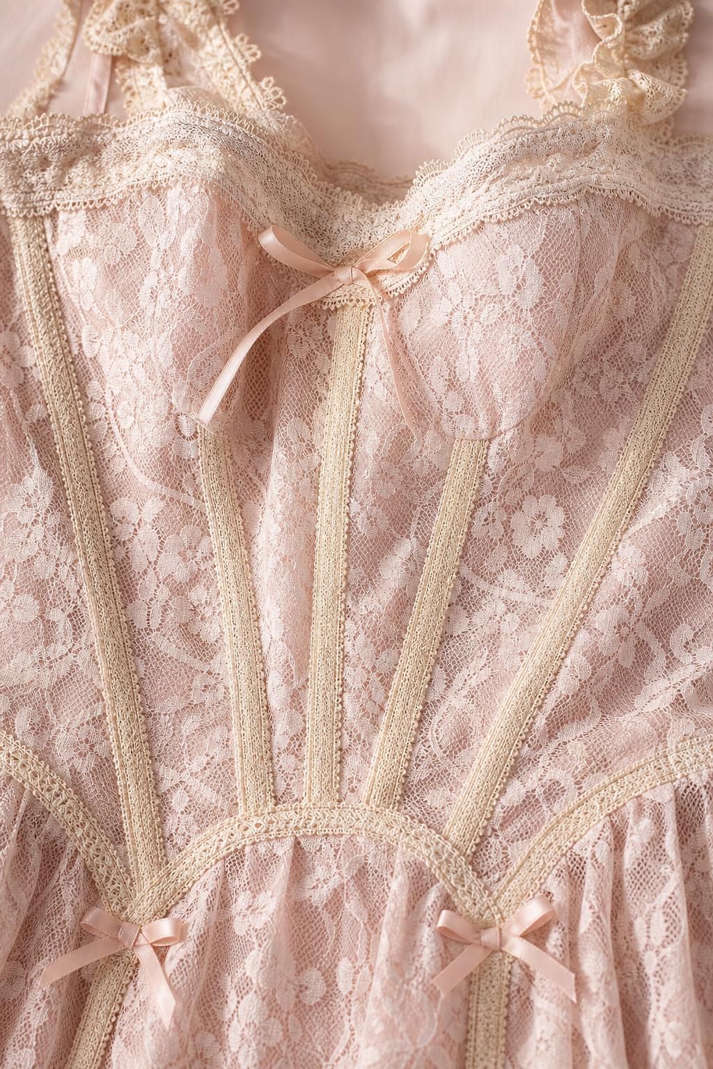 Close-up of bodice details on pink lace dress