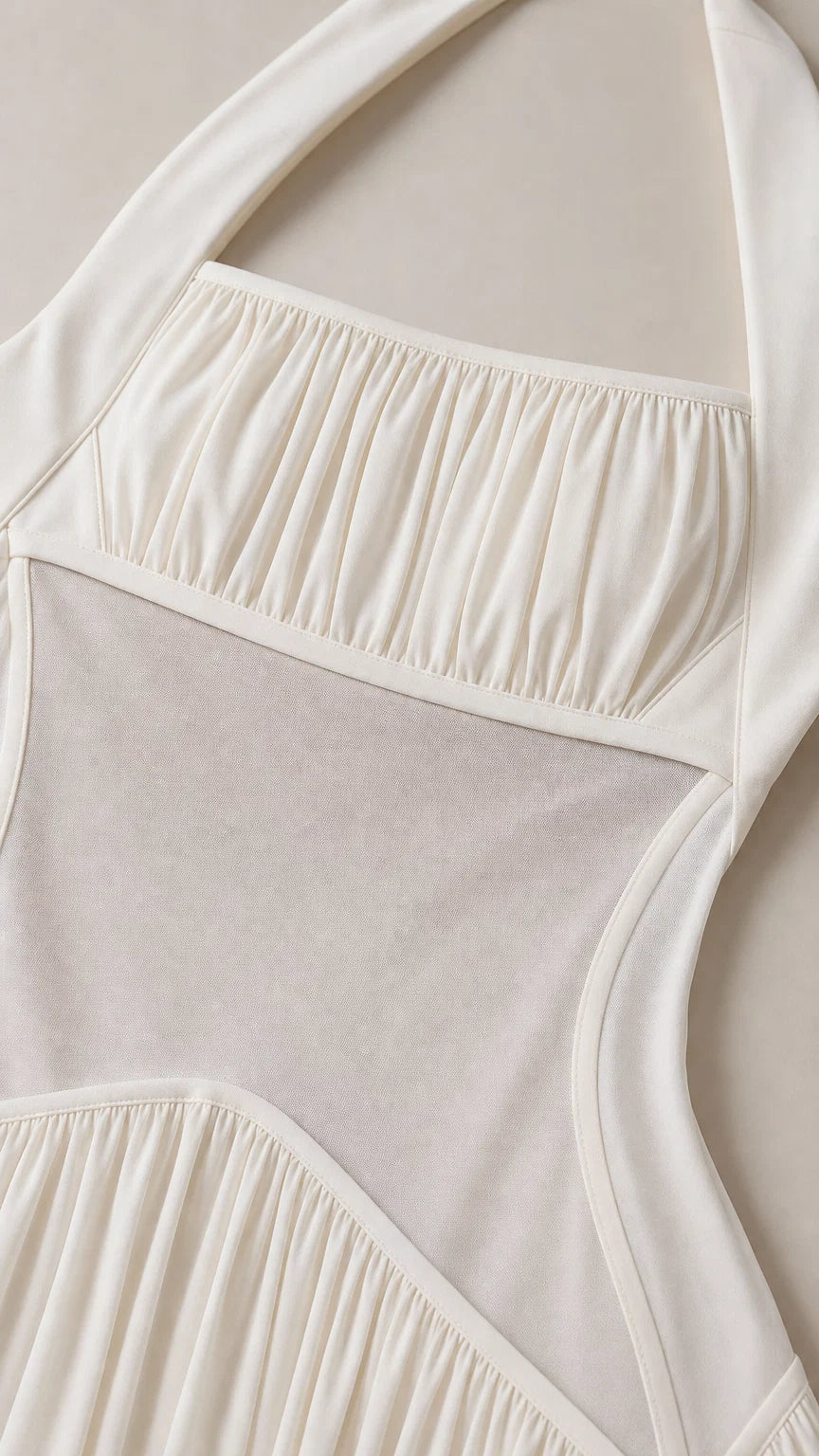 Close-up detail of the gathered bodice and sheer midsection panel