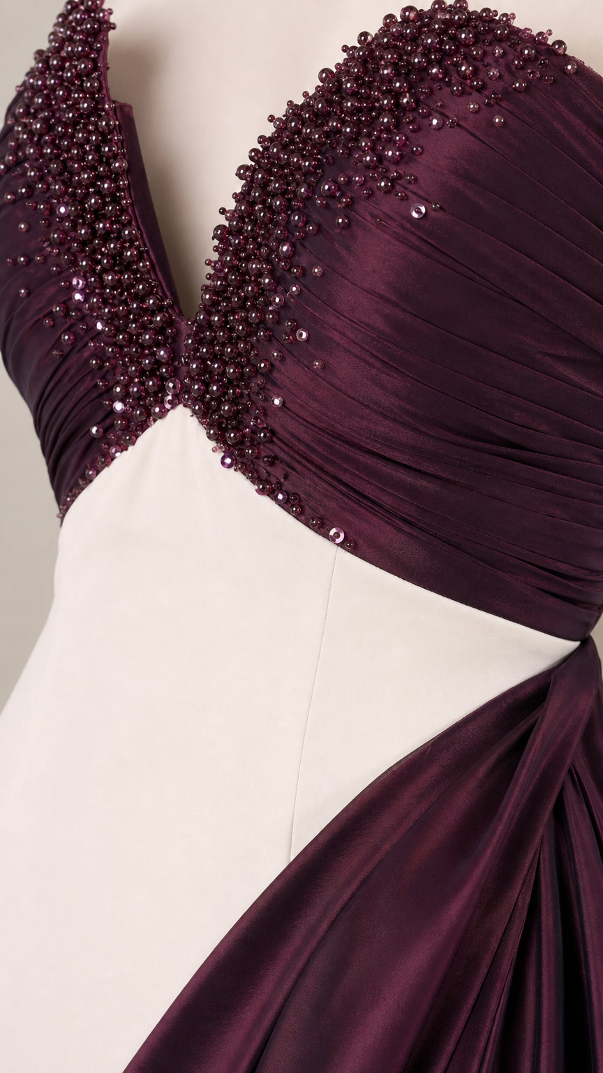 Close-up detail of heavily beaded sweetheart bodice and fabric texture