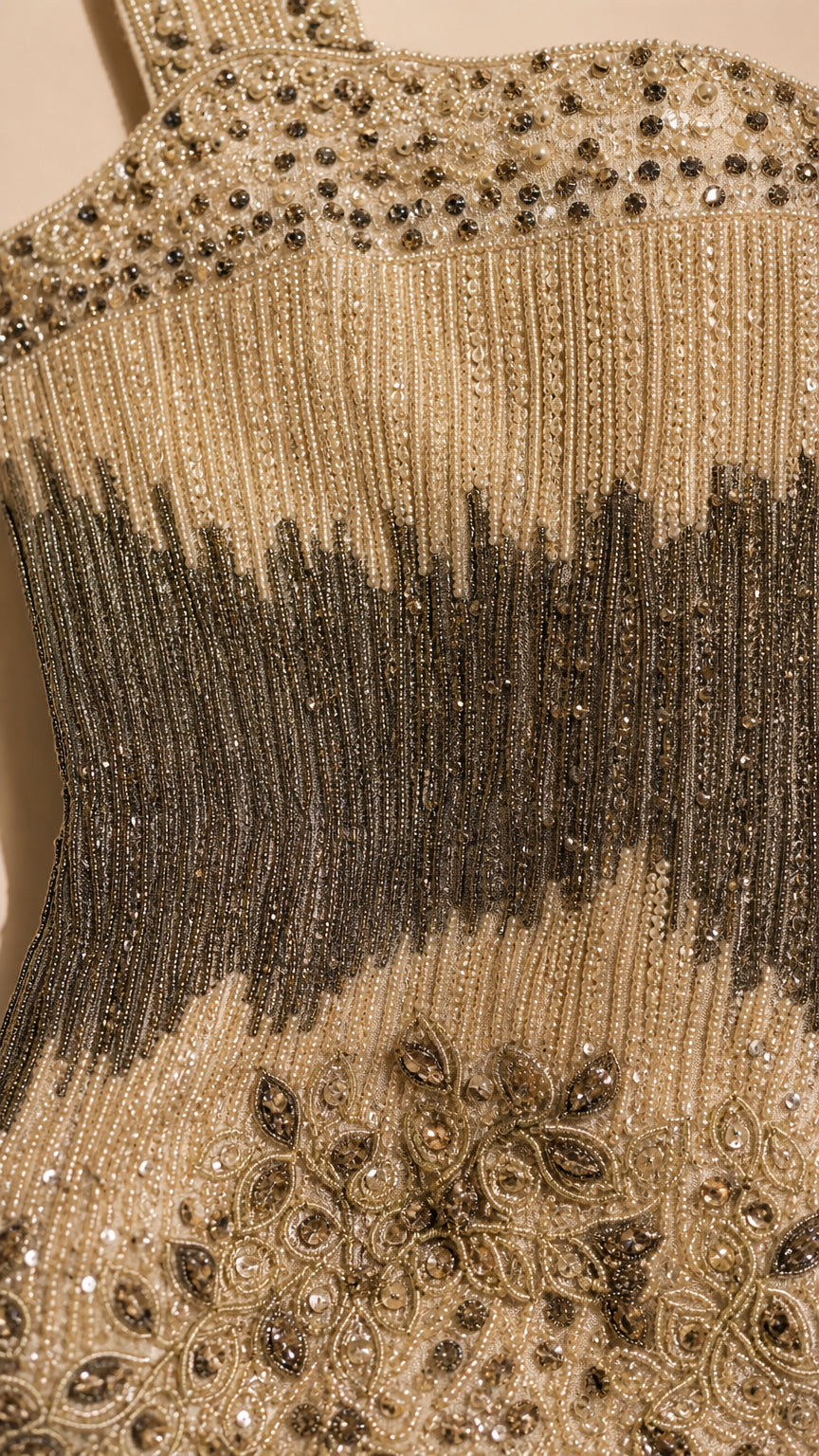 Close-up detail of intricate beadwork and shoulder straps