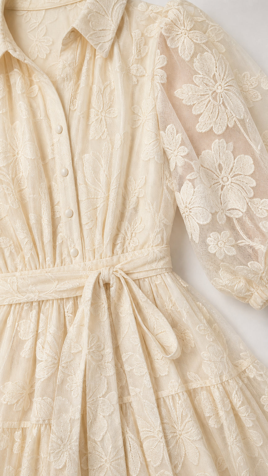 Close-up detail of shirt collar, buttons, and sheer floral embroidery