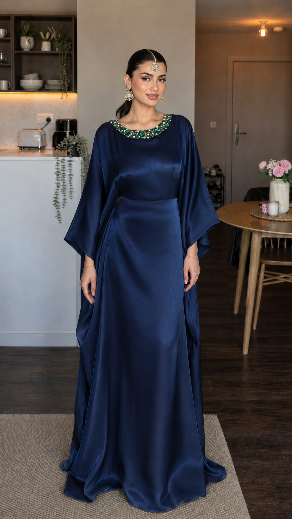 Front view of navy satin-look maxi dress with wide sleeves and embellished neckline