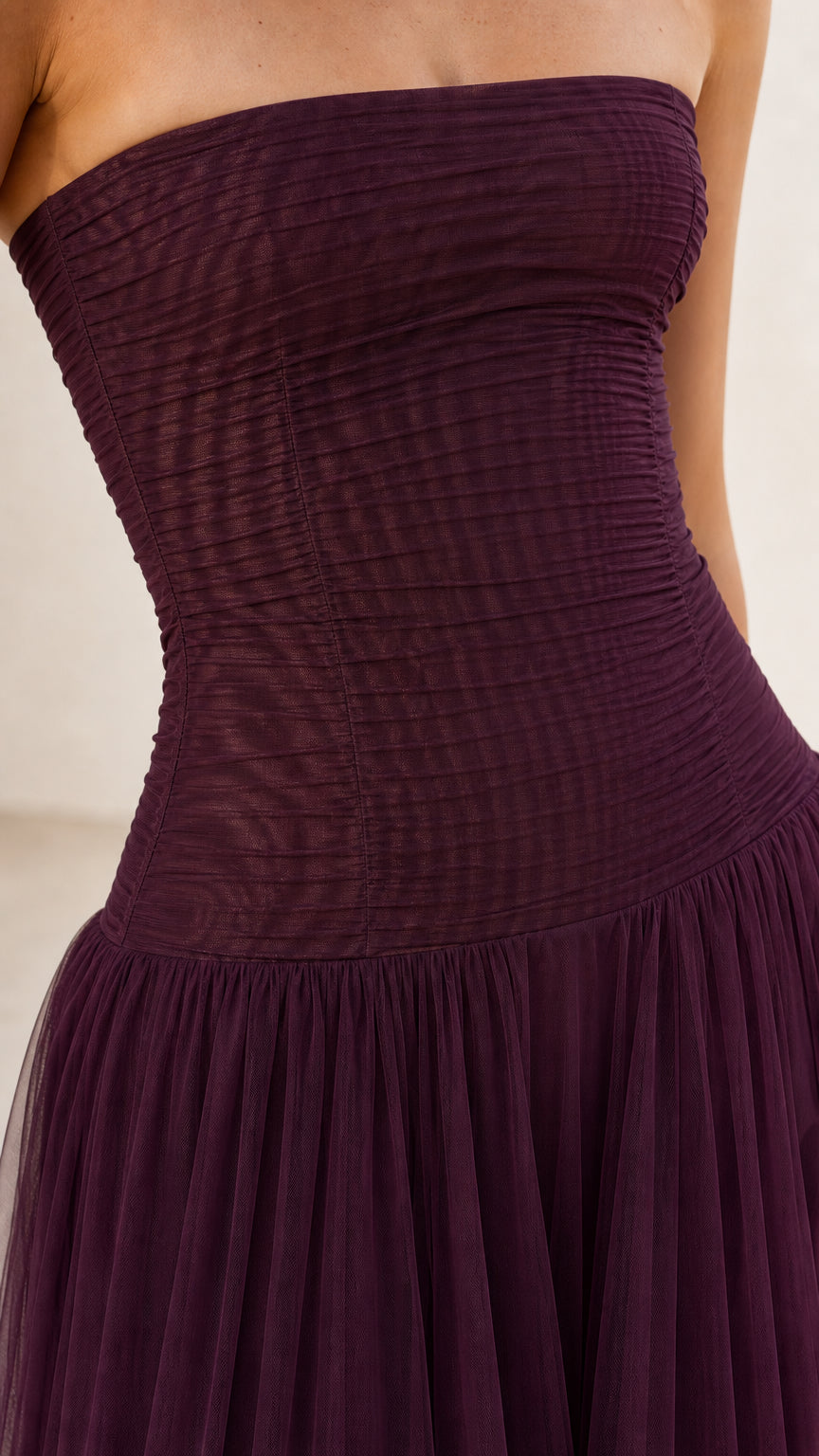 Close-up detail of ruched bodice on burgundy tulle dress