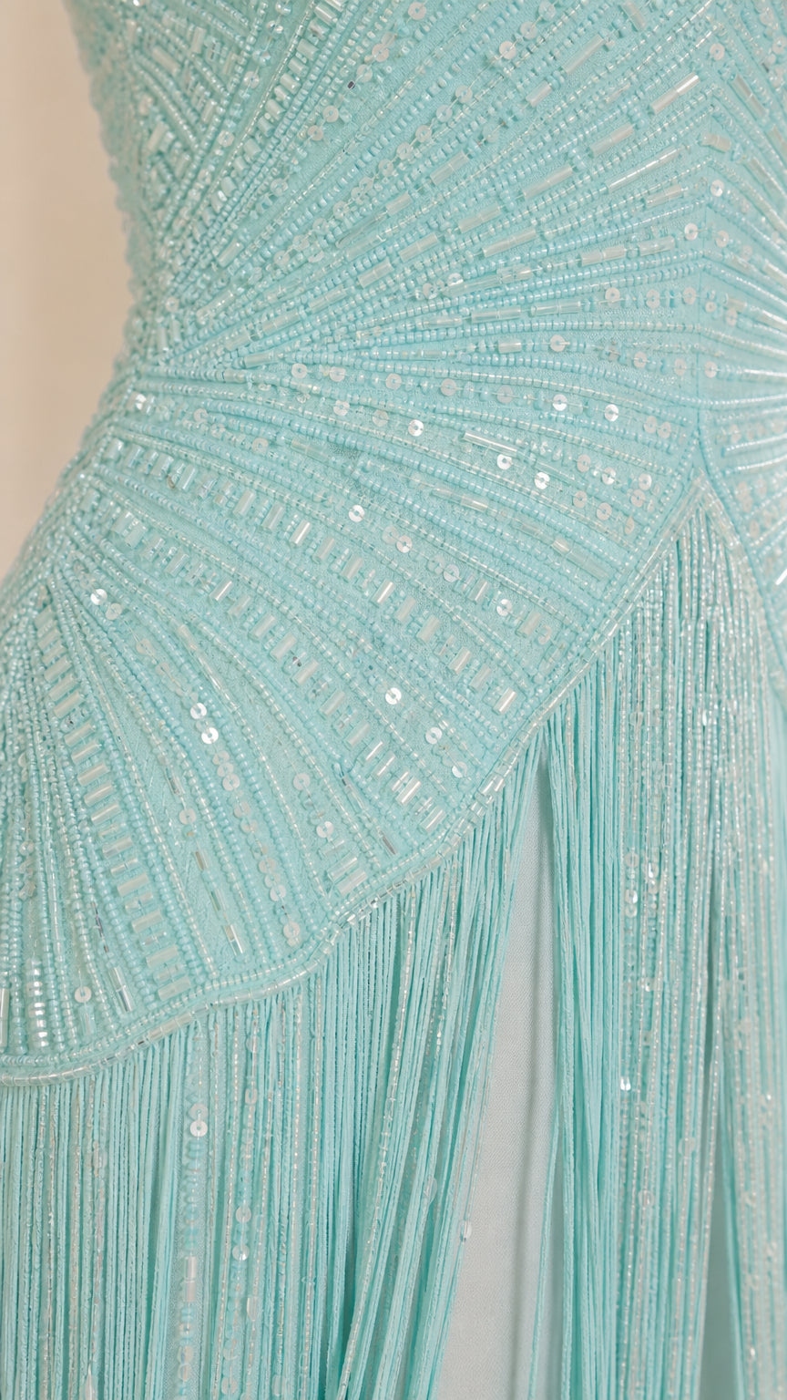 Close-up of sequin and bead embellishments with fringe