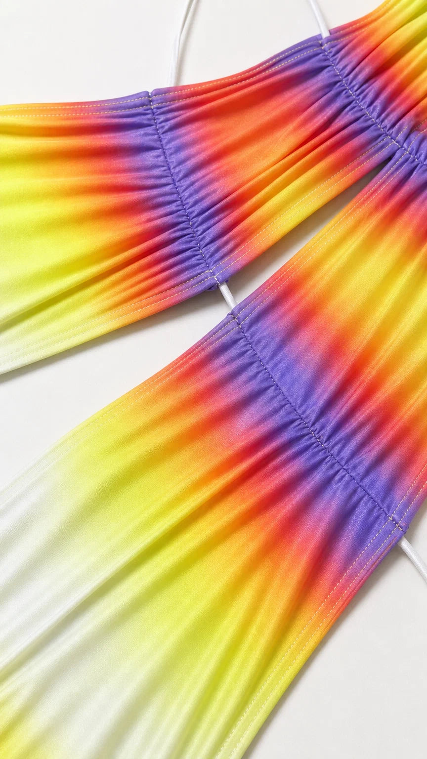 Close-up detail of ruched waist cutout and colorful gradient fabric
