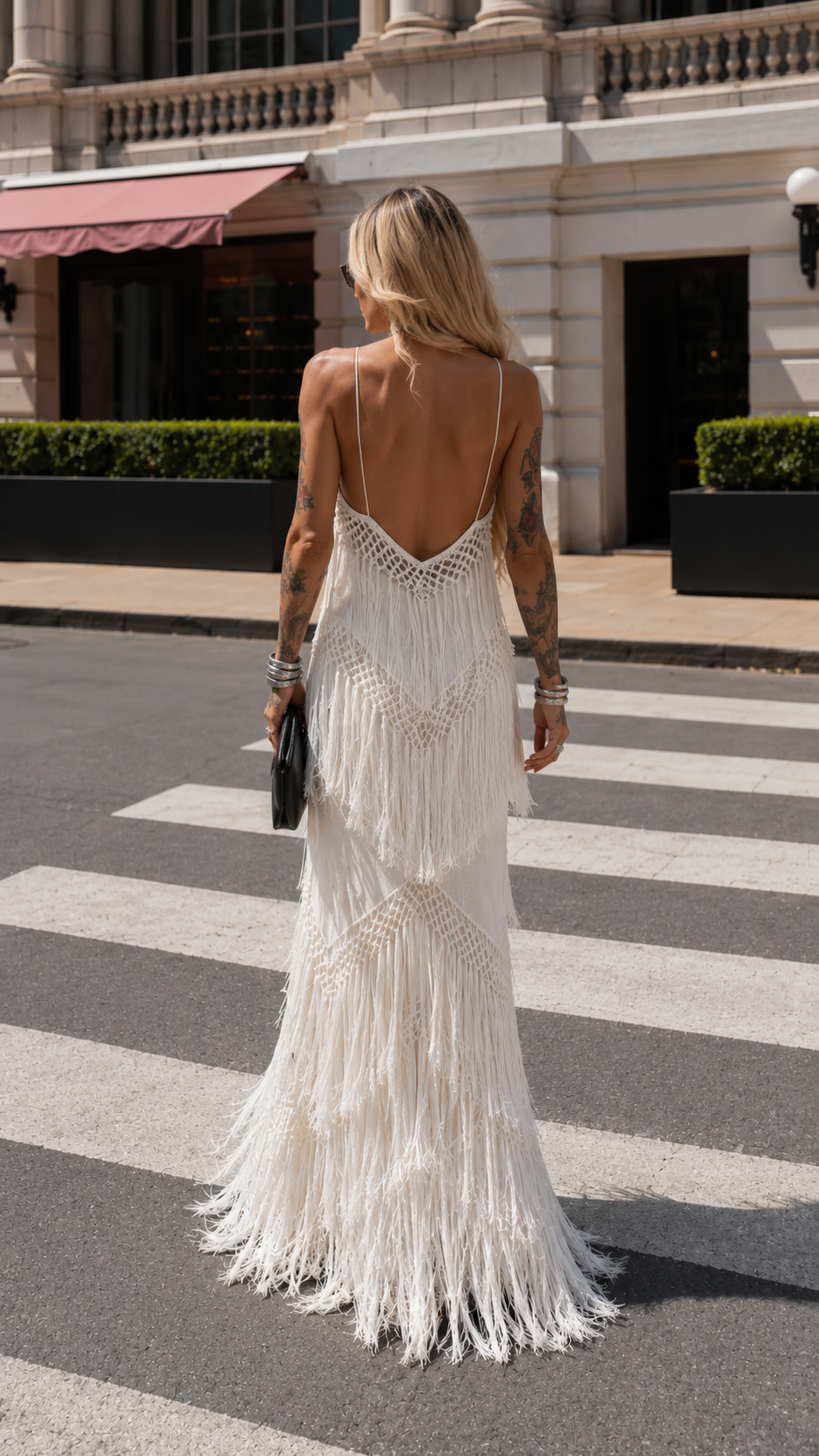 Back view of ivory fringe maxi dress with deep low back and layered fringe