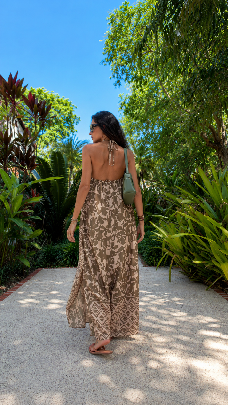 Back view of taupe printed backless halter pants set with full-length wide leg silhouette