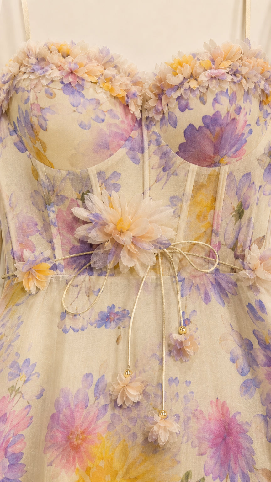 Close-up detail of sweetheart corset bodice with 3D floral appliques