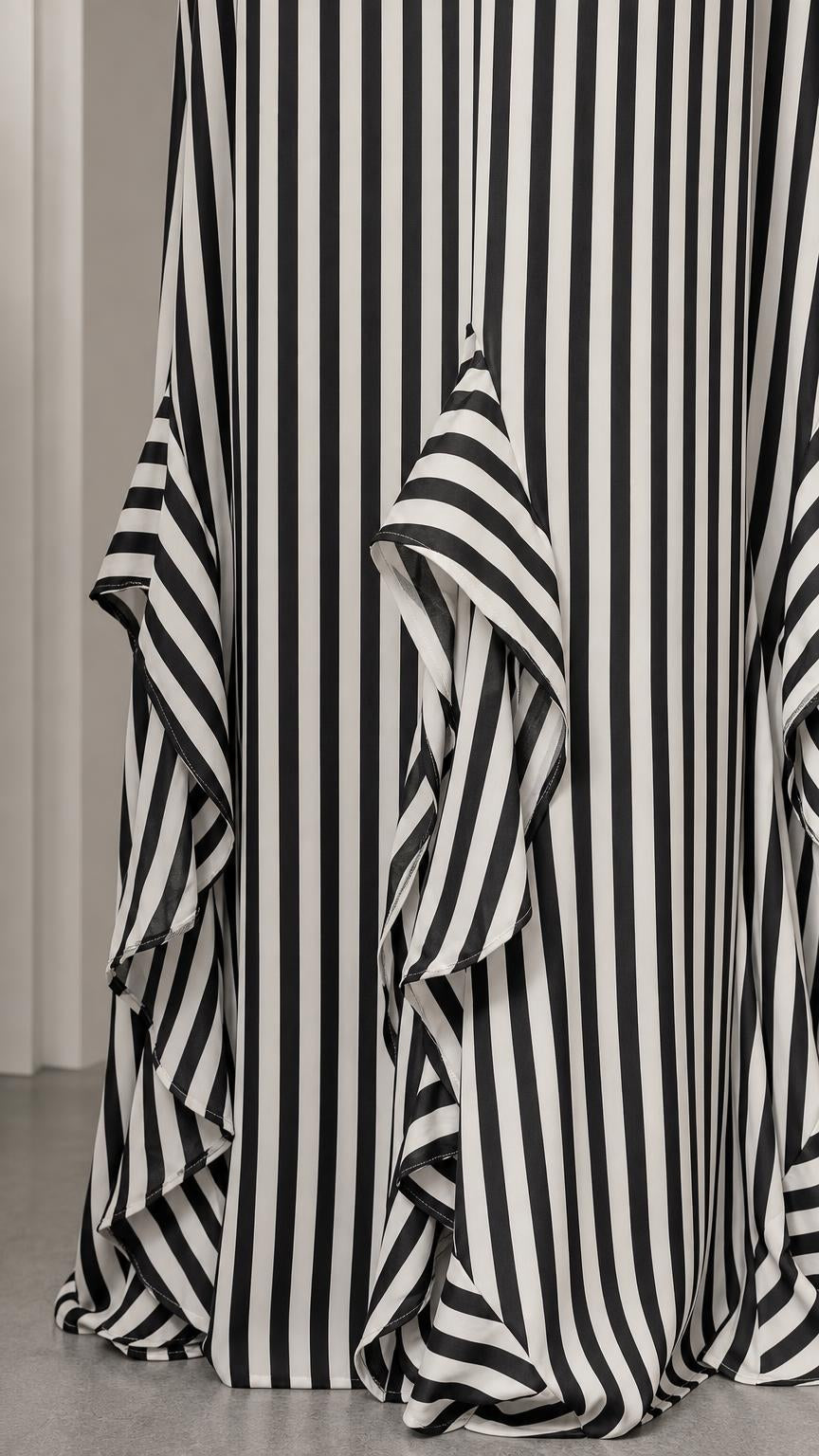 Close-up of bottom ruffle hem on striped maxi dress