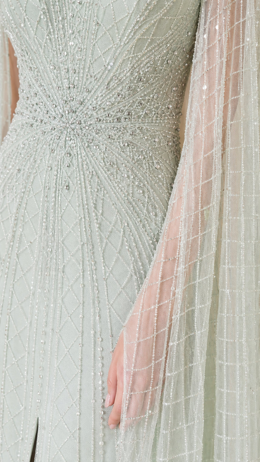 Close-up of beadwork and sheer fabric on sage green gown
