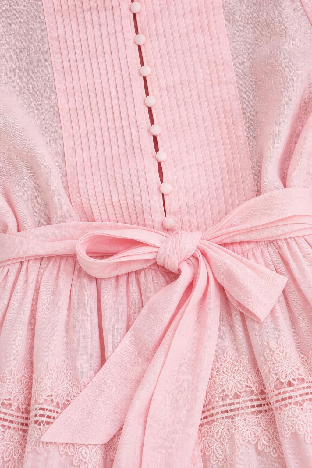 Close-up of bodice, buttons, and waist tie on pink dress