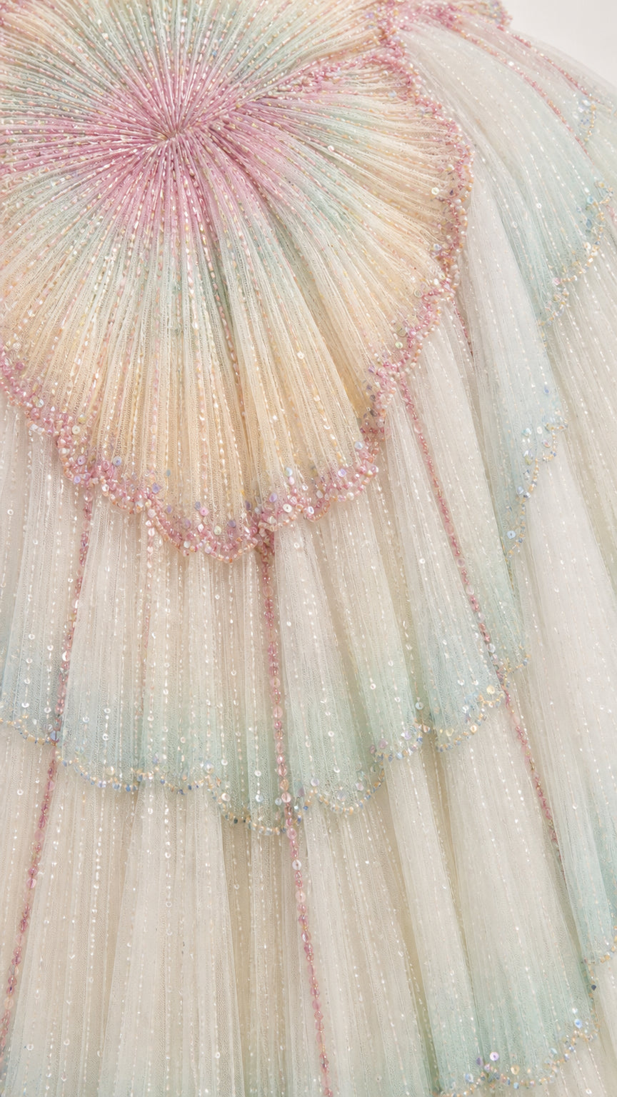 Close-up detail of intricate beadwork and tulle pleating