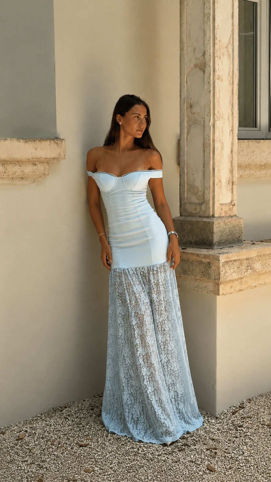 Angled front view of powder blue ruched bodycon maxi dress with sheer lace-look lower skirt