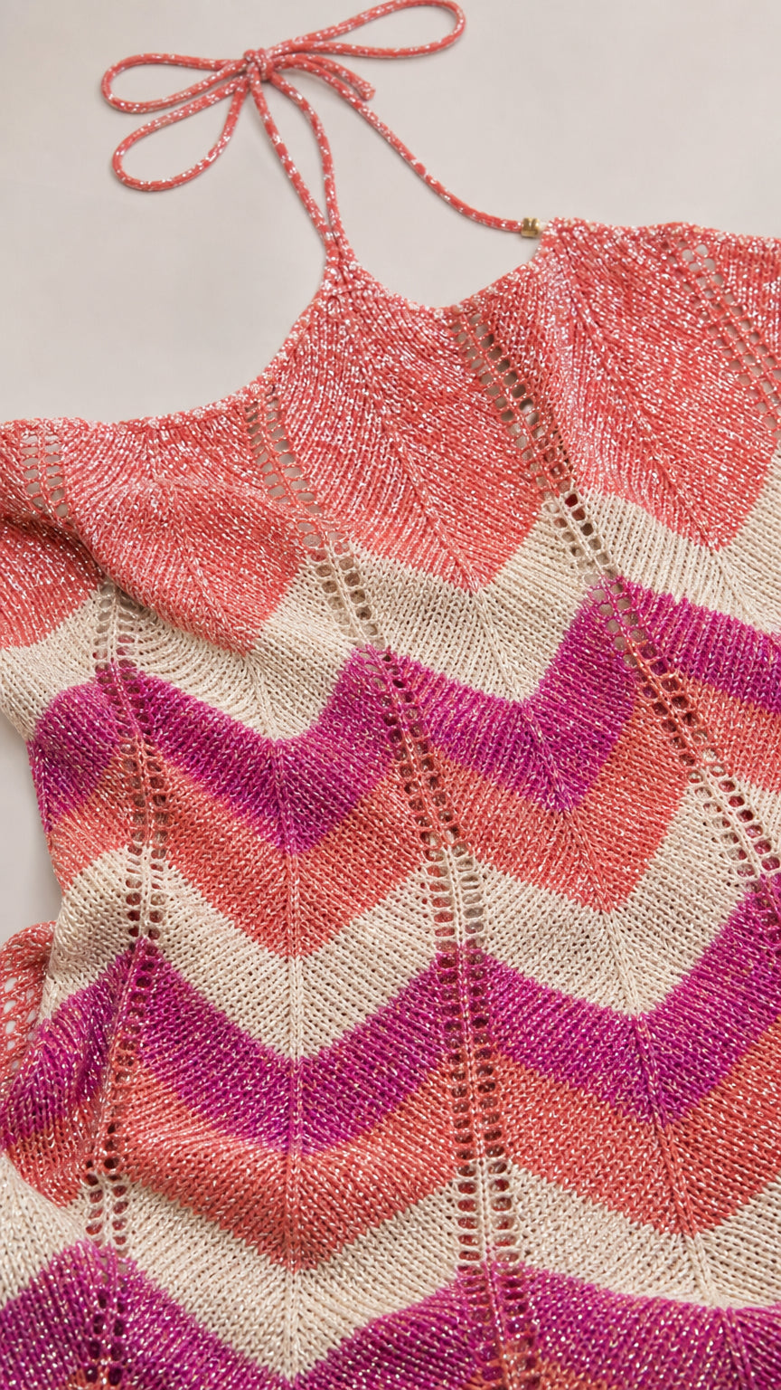 Close-up detail of the pink multi chevron knit bodice and halter tie