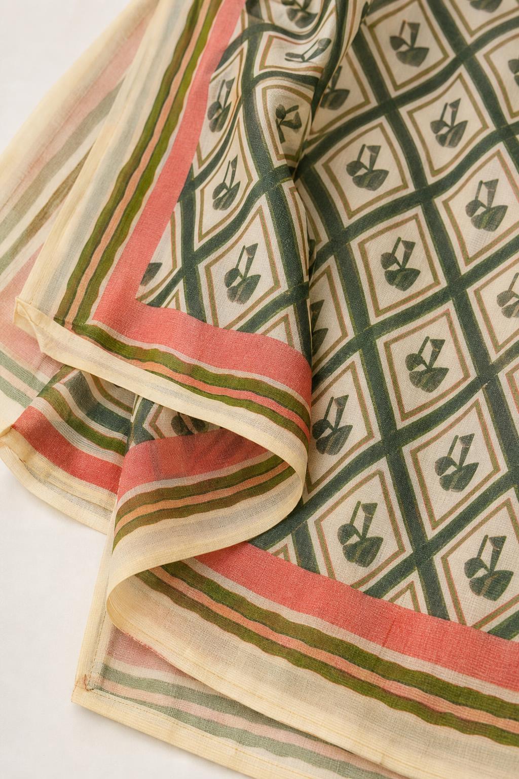 Close up of green geometric patterned fabric with contrast border