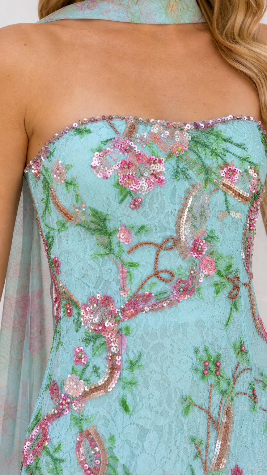 Close-up detail of sequin floral embroidery on light blue dress