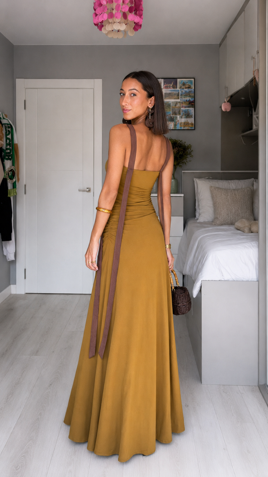 Back view of mustard maxi dress with long contrast straps and fitted bodice