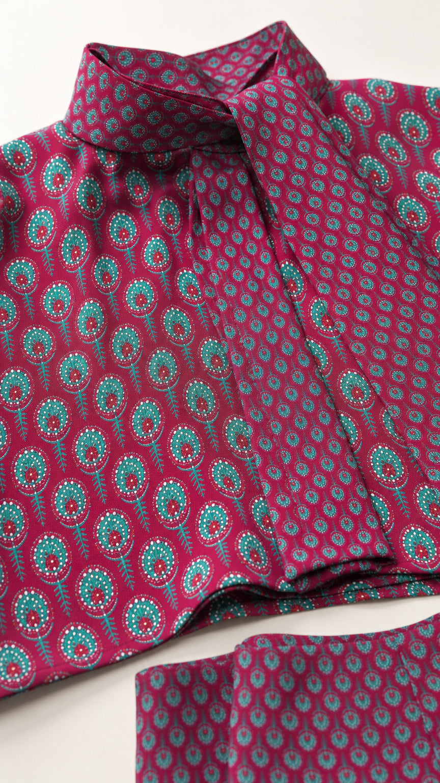Close-up fabric and collar detail of berry patterned top